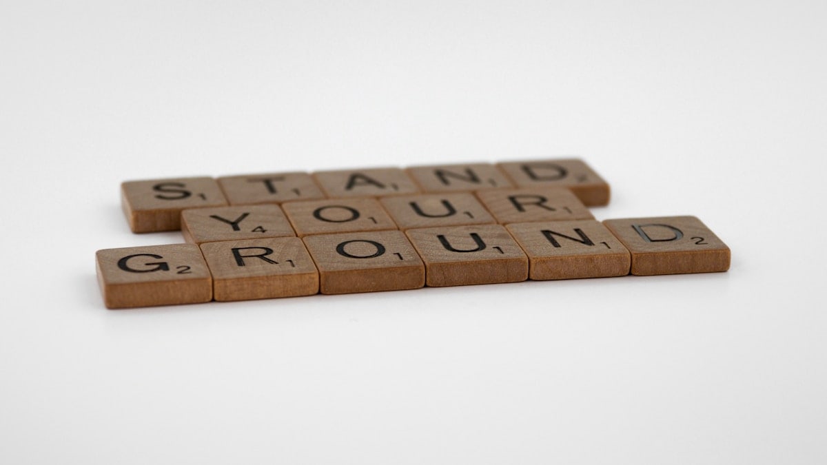 scrabble, scrabble pieces, lettering, letters, wood, scrabble tiles, white background, words, quote, letters, type, typography, design, layout, focus, bokeh, blur, photography, images, image, stand your ground, don't give up, resistance, courage, stick up for yourself, belief, conviction, integrity, protest, dig in, never surrender,